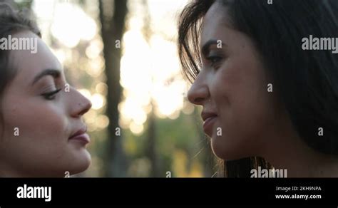 girls kissing lesbian|Two girls french kissing outside at the park. LGBT lesbian couple。